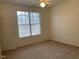 Bedroom features a window and neutral-colored carpet at 8555 W Russell Rd # 1078, Las Vegas, NV 89113