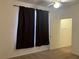Bedroom features a fan and dark curtains at 8555 W Russell Rd # 1078, Las Vegas, NV 89113