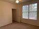 Bedroom with window and door leading to the closet at 8555 W Russell Rd # 1078, Las Vegas, NV 89113