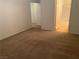 Neutral bedroom with neutral carpet and white trim at 8555 W Russell Rd # 1078, Las Vegas, NV 89113