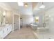 Bright bathroom featuring a soaking tub and a glass shower enclosure at 8816 Saint Pierre Dr, Las Vegas, NV 89134