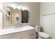 Clean bathroom with modern fixtures, a large mirror, and a toilet at 8816 Saint Pierre Dr, Las Vegas, NV 89134