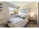 Well-lit bedroom featuring a large window and minimalist decor at 8816 Saint Pierre Dr, Las Vegas, NV 89134
