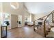 Spacious foyer showcasing modern wood flooring, staircase, and a sunlit view at 8816 Saint Pierre Dr, Las Vegas, NV 89134