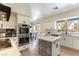 Modern kitchen with stainless steel appliances, an island, and bright white cabinets at 8816 Saint Pierre Dr, Las Vegas, NV 89134