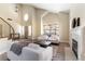 Bright, open living space with fireplace and a modern staircase at 8816 Saint Pierre Dr, Las Vegas, NV 89134