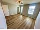Bedroom featuring wood-look floors and natural lighting at 9136 Cocowoods Pl, Las Vegas, NV 89148