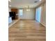 Dining room with modern light fixture and wood flooring at 9136 Cocowoods Pl, Las Vegas, NV 89148