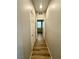 Hallway features clean white doors and wood flooring at 9136 Cocowoods Pl, Las Vegas, NV 89148