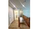 Second floor hallway with staircase and access to laundry room with washer and dryer at 9136 Cocowoods Pl, Las Vegas, NV 89148