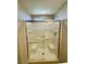 Bright tiled shower with glass doors at 9136 Cocowoods Pl, Las Vegas, NV 89148