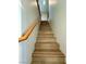 Stairway with modern wood railing and wood steps at 9136 Cocowoods Pl, Las Vegas, NV 89148