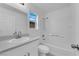 Bathroom features a shower over tub, white vanity and contemporary fixtures at 9315 Indian Corn Ct # 101, Las Vegas, NV 89178