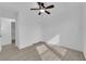 This bright bedroom features hardwood floors, a ceiling fan, and a sliding door closet at 9315 Indian Corn Ct # 101, Las Vegas, NV 89178