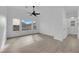 Bright bedroom features large windows, ceiling fan, and light wood-look floors at 9315 Indian Corn Ct # 101, Las Vegas, NV 89178