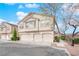 Inviting townhouse featuring a neutral color scheme, attached garages and well maintained landscaping at 9315 Indian Corn Ct # 101, Las Vegas, NV 89178