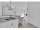 Open concept kitchen and living space with light grey counters at 9315 Indian Corn Ct # 101, Las Vegas, NV 89178