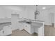 Kitchen with light grey countertops and modern cabinets is move-in ready at 9315 Indian Corn Ct # 101, Las Vegas, NV 89178