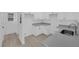 Well-lit kitchenette with light grey countertops and modern cabinets at 9315 Indian Corn Ct # 101, Las Vegas, NV 89178