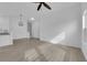 Bright open space with light wood-look floors leading to kitchen area at 9315 Indian Corn Ct # 101, Las Vegas, NV 89178
