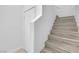 Bright staircase featuring luxury vinyl flooring and white trim at 9315 Indian Corn Ct # 101, Las Vegas, NV 89178