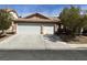 Charming single-story home with a three-car garage and well-maintained landscaping at 9436 Silvaner Ct, Las Vegas, NV 89123