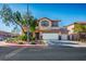 Charming two-story home with well-manicured landscaping and a three-car garage at 948 Mill Run Creek Ave, Henderson, NV 89002