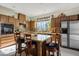 Modern kitchen featuring granite countertops, stainless steel appliances, and a center island at 948 Mill Run Creek Ave, Henderson, NV 89002