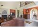 Bright and spacious living room with elegant fireplace and stylish decor at 948 Mill Run Creek Ave, Henderson, NV 89002
