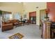 Spacious living room with high ceilings, tiled flooring, and comfortable furnishings at 948 Mill Run Creek Ave, Henderson, NV 89002