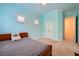 Bedroom with bright paint, shuttered windows, and a ceiling fan at 9733 Camden Hills Ave, Las Vegas, NV 89145