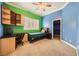 Bright bedroom featuring built-in desk, storage, and window shutters at 9733 Camden Hills Ave, Las Vegas, NV 89145