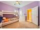 Bedroom featuring a bunk bed, a dresser, and shuttered windows at 9733 Camden Hills Ave, Las Vegas, NV 89145