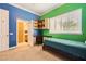 Bedroom featuring built-in desk and attached bathroom for convenience at 9733 Camden Hills Ave, Las Vegas, NV 89145