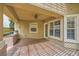Outdoor patio with a built-in brick grill and ceiling fan for comfortable outdoor cooking and relaxing at 9733 Camden Hills Ave, Las Vegas, NV 89145