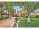 Inviting two-story home with lush front yard, mature tree, and a well-maintained lawn at 9733 Camden Hills Ave, Las Vegas, NV 89145