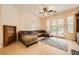 Comfortable living room with a sectional sofa, access to the backyard, and built-in bookcases at 9733 Camden Hills Ave, Las Vegas, NV 89145