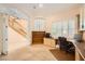 Spacious office featuring built-in cabinets, a large desk, and natural light at 9733 Camden Hills Ave, Las Vegas, NV 89145