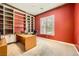 Bright office with built-in bookcase, a large desk, and a neutral color scheme at 9733 Camden Hills Ave, Las Vegas, NV 89145