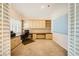 Bright home office with built-in cabinets, shelving, and a large desk at 9733 Camden Hills Ave, Las Vegas, NV 89145