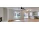 Open floorplan featuring a living room and kitchen with breakfast bar, and lots of natural light at 9855 Ashton Pines Ct, Las Vegas, NV 89147