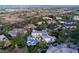 Expansive aerial view of the community highlighting lush landscaping and a large modern home with an inground pool at 1108 Pine Island Ct, Las Vegas, NV 89134