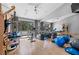 Bright exercise room with mirrored wall, wood floors, and modern fitness equipment at 1108 Pine Island Ct, Las Vegas, NV 89134