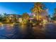 Stunning home with landscape lighting, a circular driveway, and a meticulously designed front yard at 1108 Pine Island Ct, Las Vegas, NV 89134