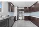 Spacious laundry room with modern machines, custom cabinetry, and a sleek countertop at 1108 Pine Island Ct, Las Vegas, NV 89134