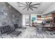 Modern office featuring a statement stone wall, built-in shelves, and contemporary furniture at 1108 Pine Island Ct, Las Vegas, NV 89134