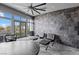 Modern office showcasing statement stone wall, expansive windows, and contemporary furniture at 1108 Pine Island Ct, Las Vegas, NV 89134