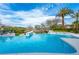 Stunning pool view showcasing clear blue water and lush landscaping at 1108 Pine Island Ct, Las Vegas, NV 89134