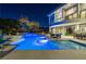 Beautifully lit pool area at night, showcasing the modern home and tropical landscaping at 1108 Pine Island Ct, Las Vegas, NV 89134