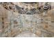 Luxurious shower features intricate tilework, multiple showerheads, and built-in bench for a spa-like experience at 1108 Pine Island Ct, Las Vegas, NV 89134